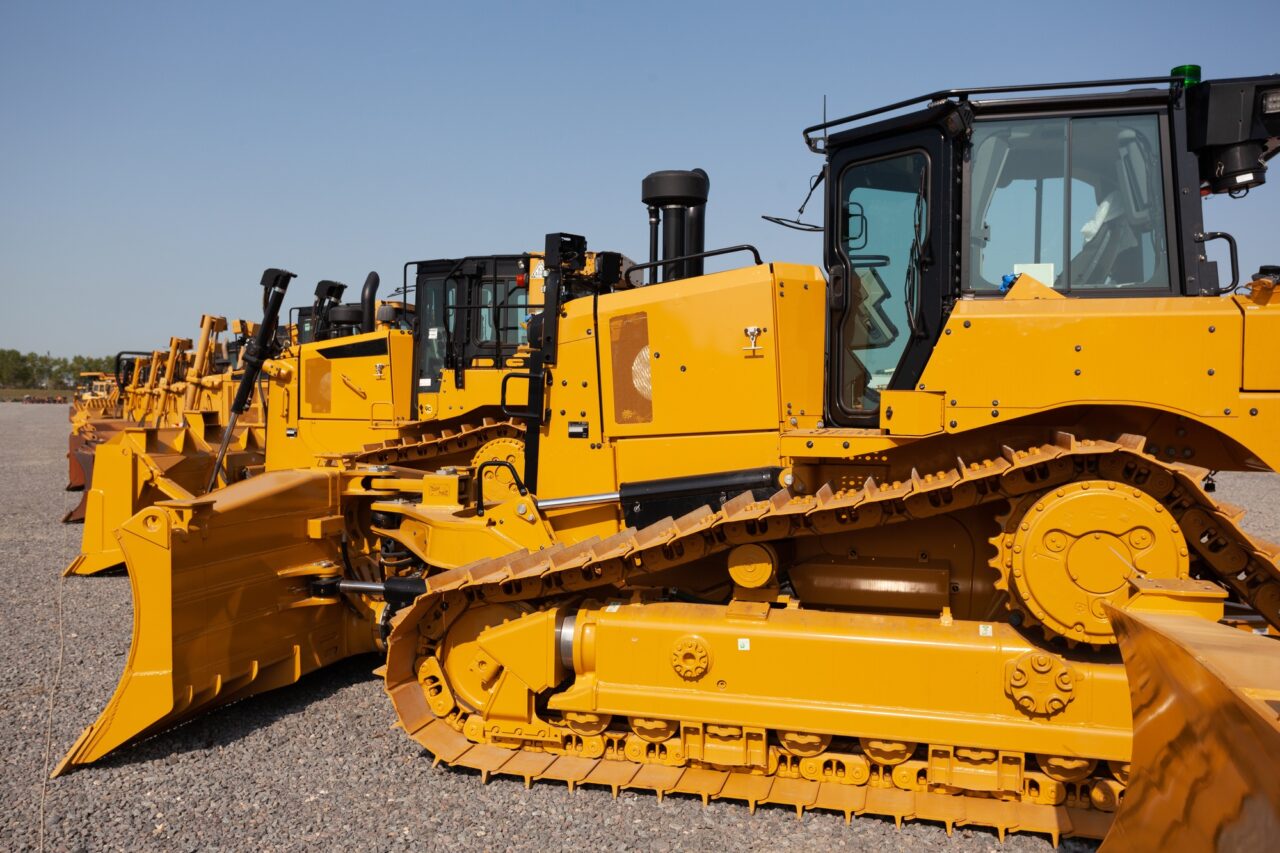 row of bulldozers in a construction site.jpg